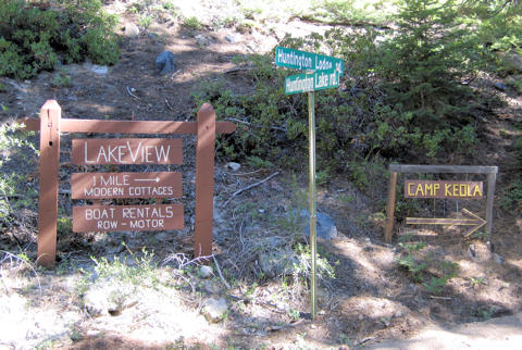 Photo of the intersection where you turn to come to camp, with Lakeview Cottages and Camp Keola signs